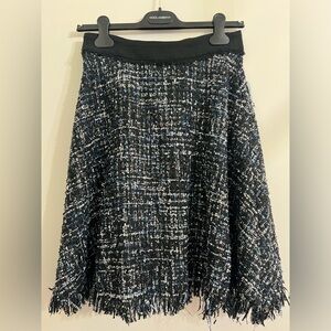 Tweed skirt with raw hem finish